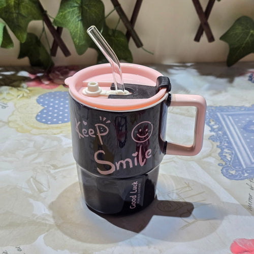 BioCode black ceramic mug with pink lid, glass straw, and Keep Smile slogan with a smiley face graphic