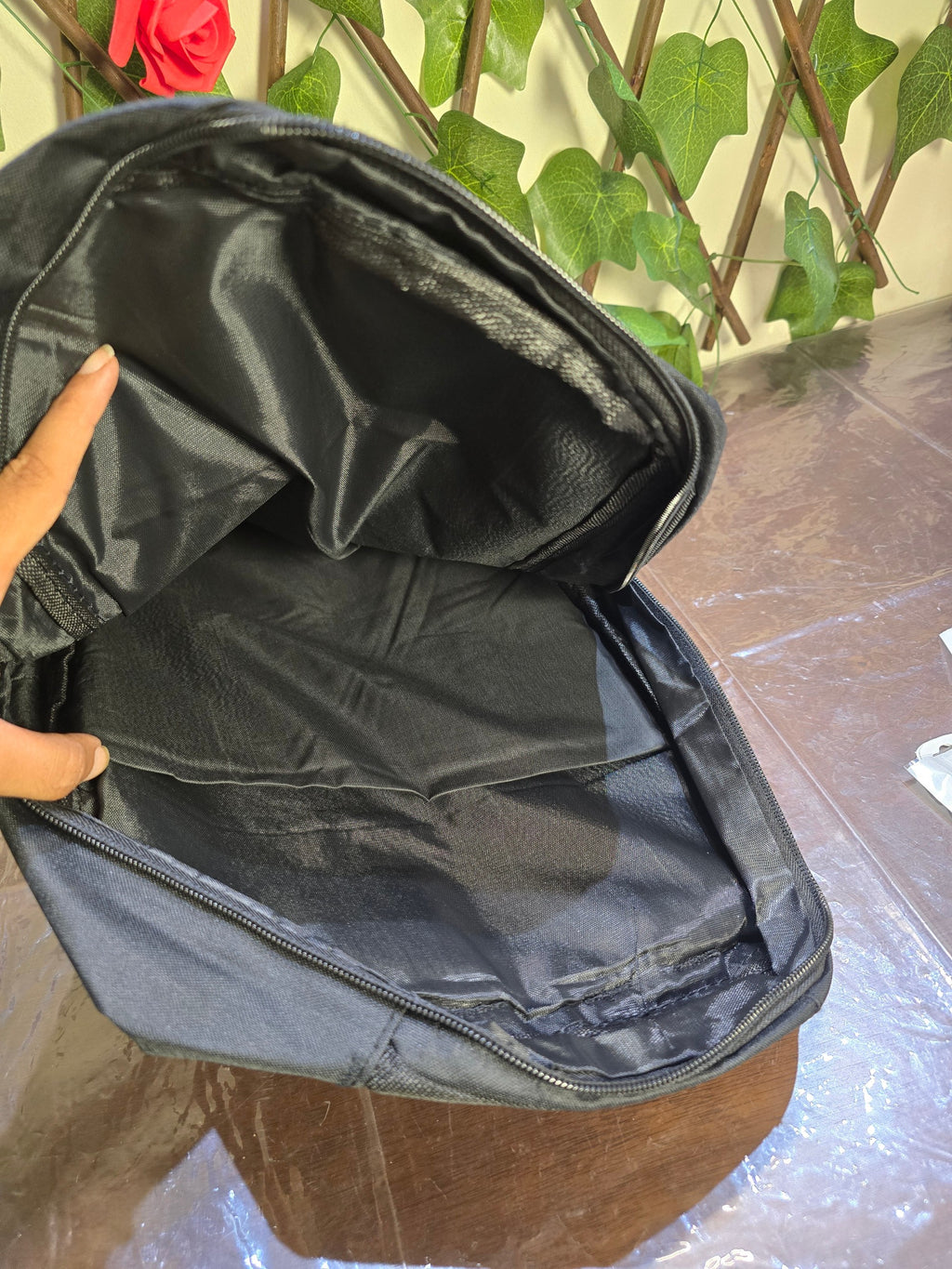 BioCode black minimalist commuter backpack with a spacious open main compartment and durable fabric lining