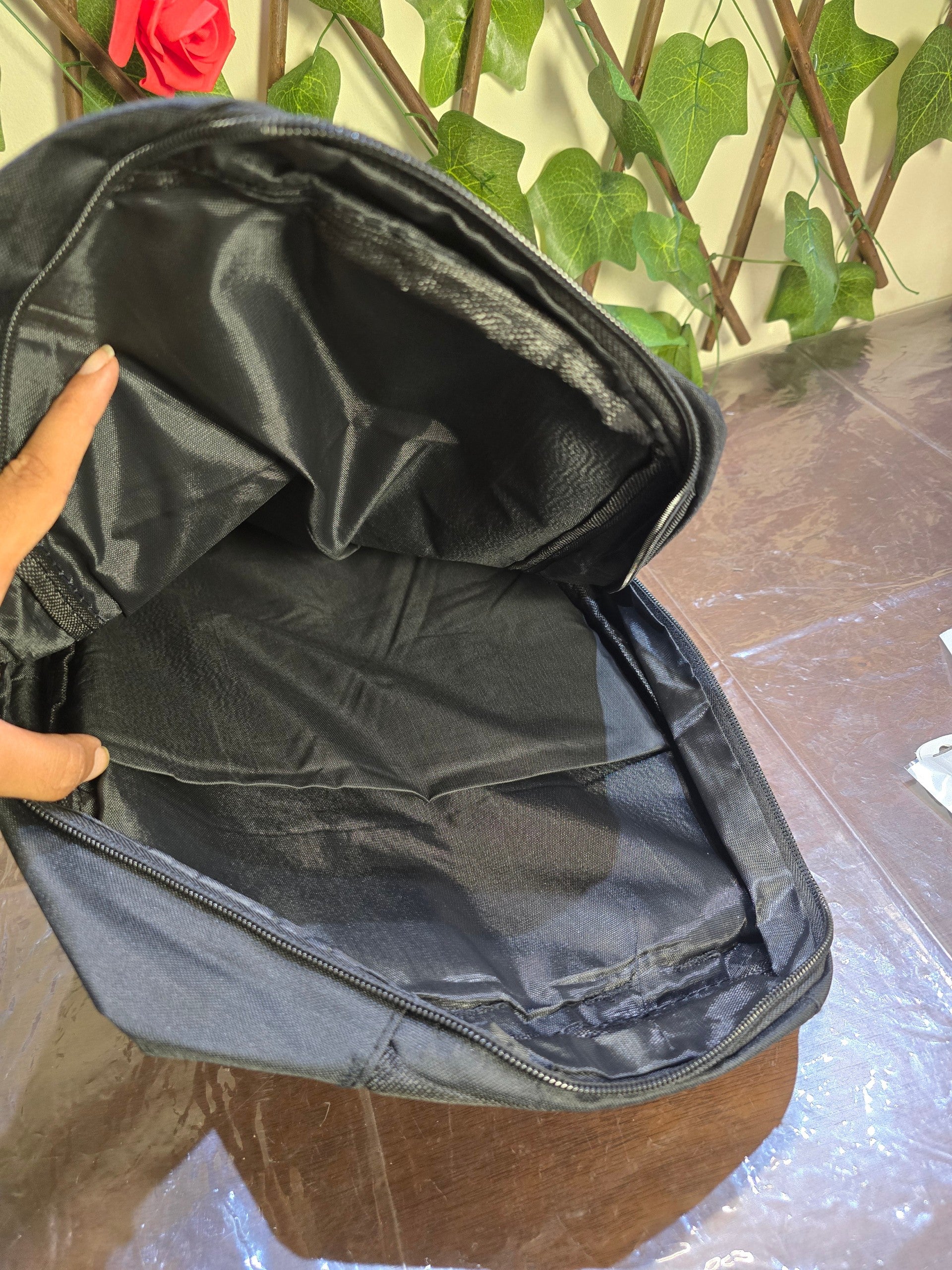 BioCode black minimalist commuter backpack with a spacious open main compartment and durable fabric lining