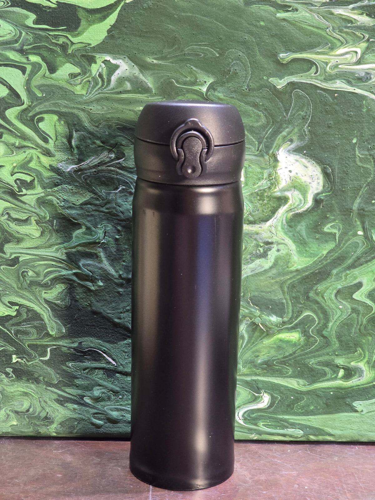 BioCode insulated stainless steel travel flask in matte black with a secure leak-proof flip-top lid