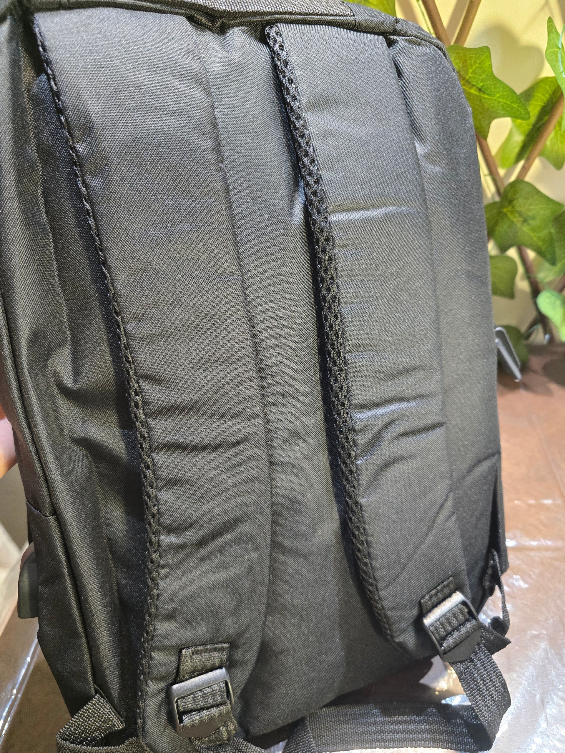 BioCode black water-resistant backpack featuring ergonomic padded shoulder straps and adjustable buckles