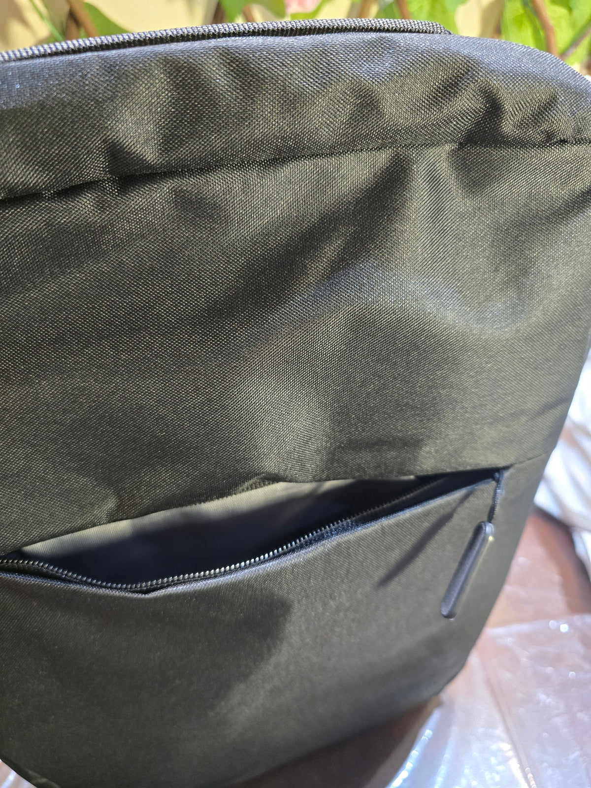BioCode black water-resistant everyday backpack with a minimalist design and a secure front zip pocket.