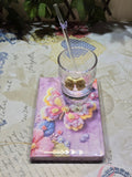 BioCode decorative glassware set featuring a textured glass tumbler with a cream bow, glass straw, and butterfly book.