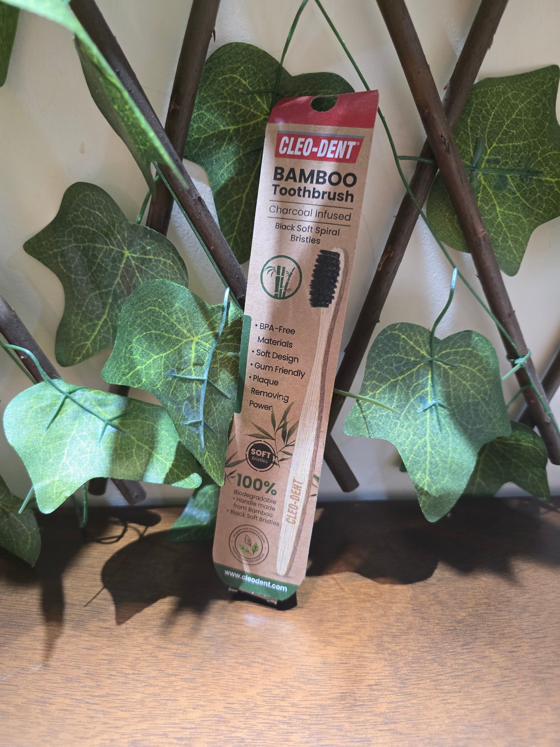 BioCode Cleo-Dent charcoal-infused bamboo toothbrush with soft black spiral bristles in sustainable paper packaging