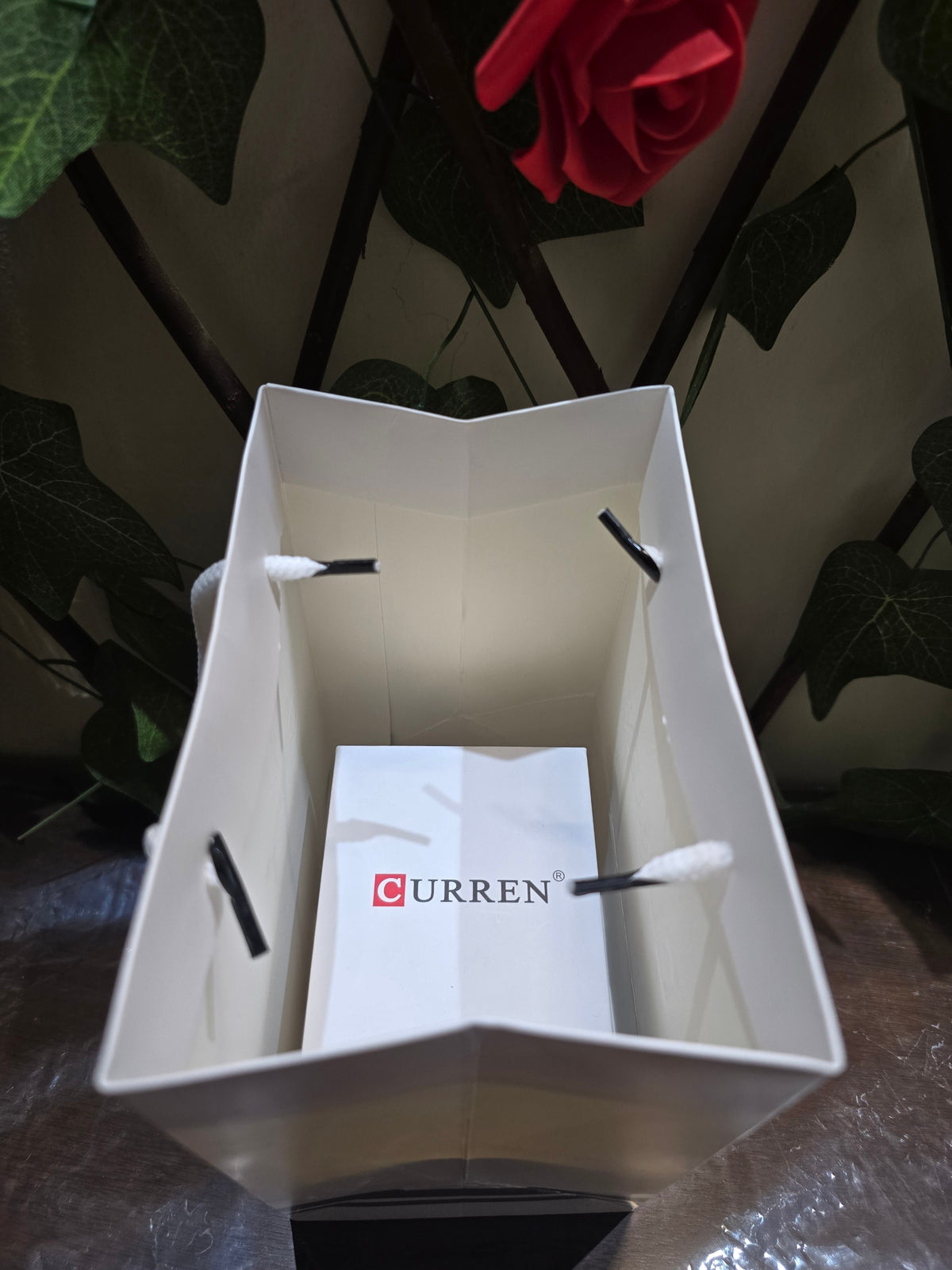 BioCode branded white gift bag containing a CURREN watch box, presented for a premium gift experience.