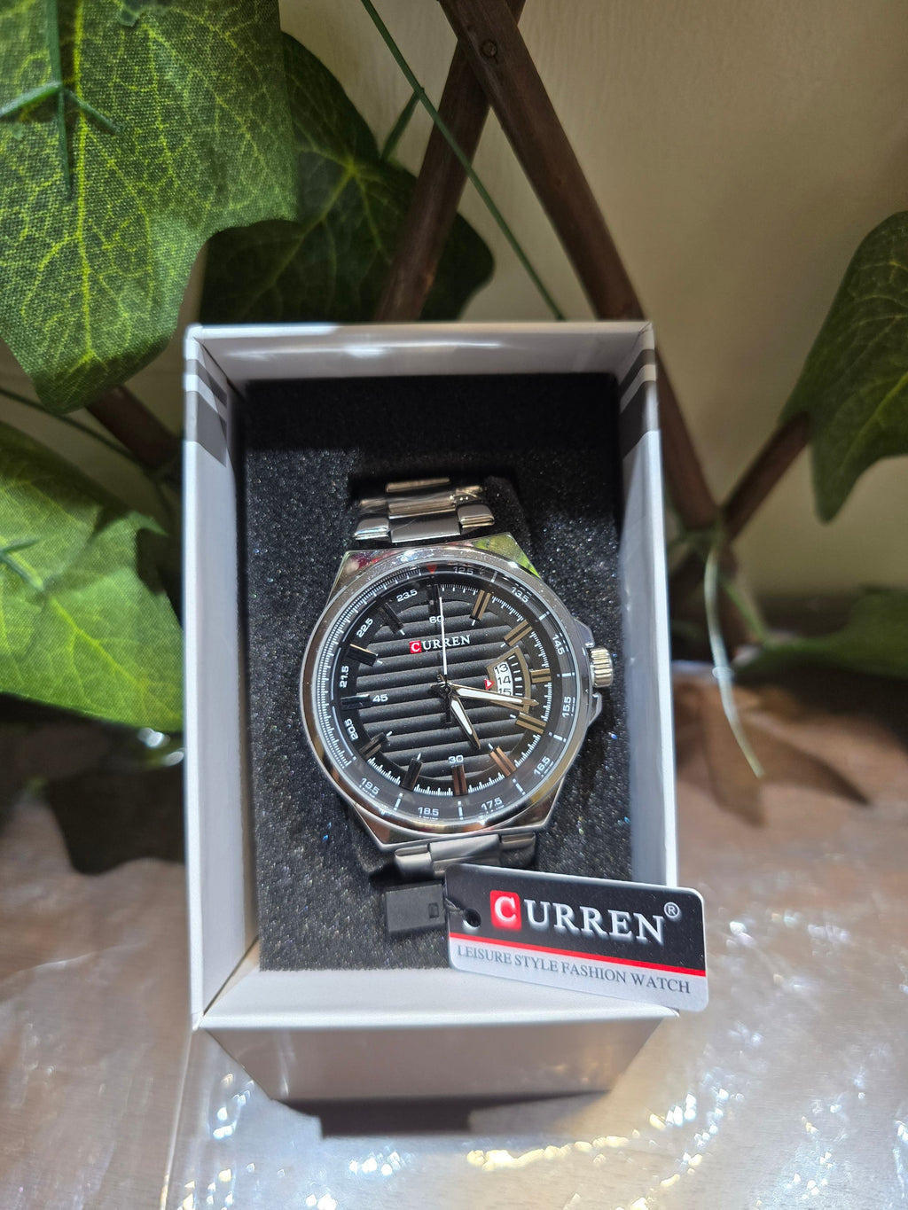BioCode CURREN men's leisure style watch with a textured black dial and stainless steel bracelet in a gift box