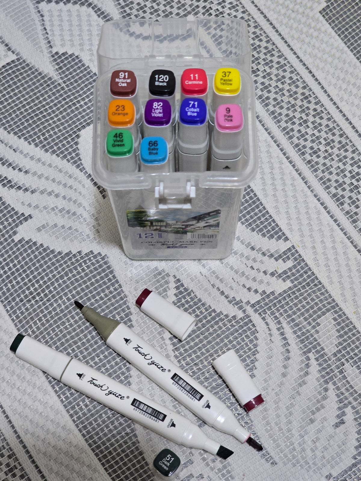 BioCode 12-piece dual tip marker set in a transparent carry case with two pens displayed on a textured white surface