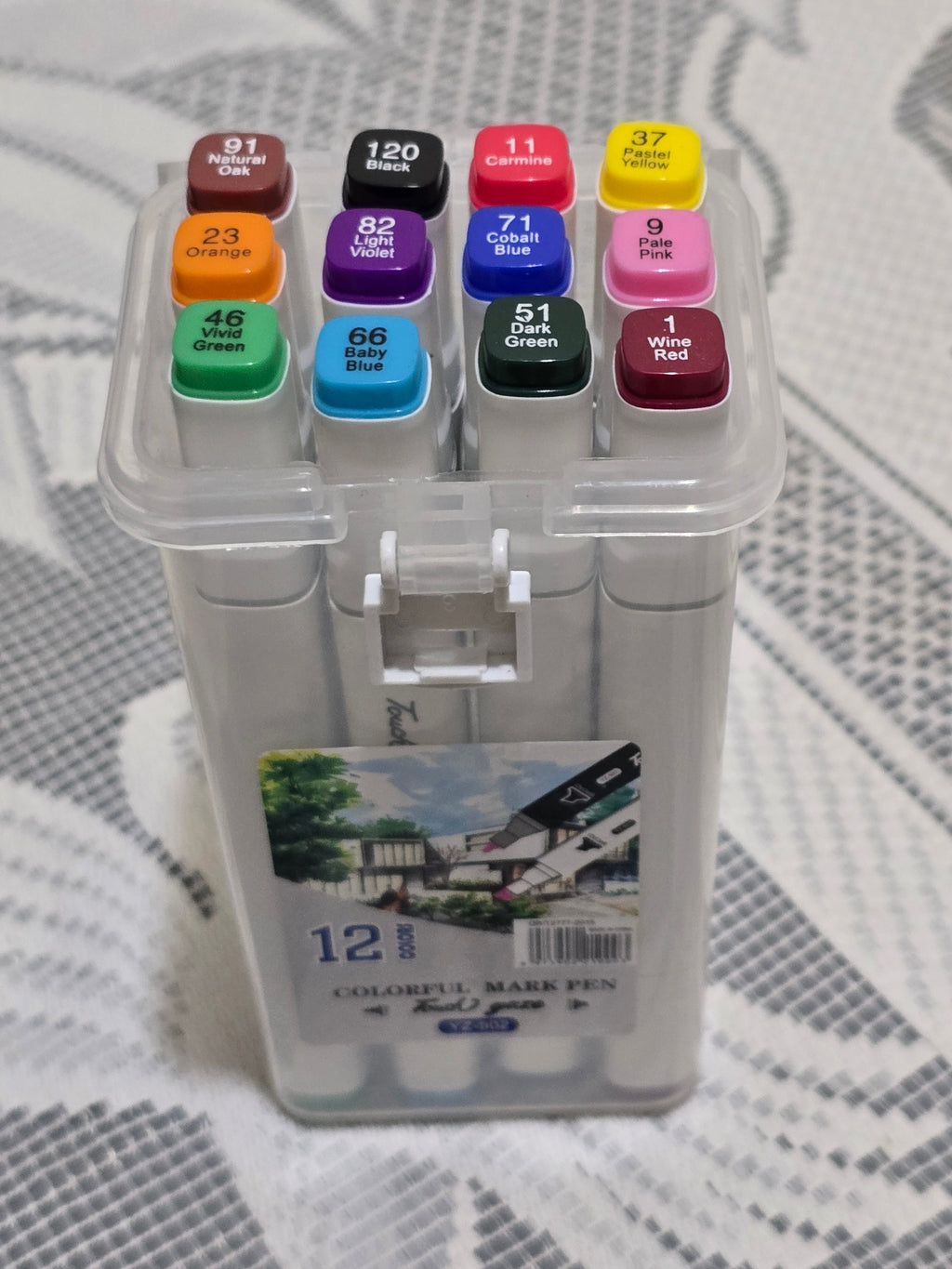 BioCode 12-piece dual tip artist marker set in a clear plastic carry case with vibrant assorted ink colours