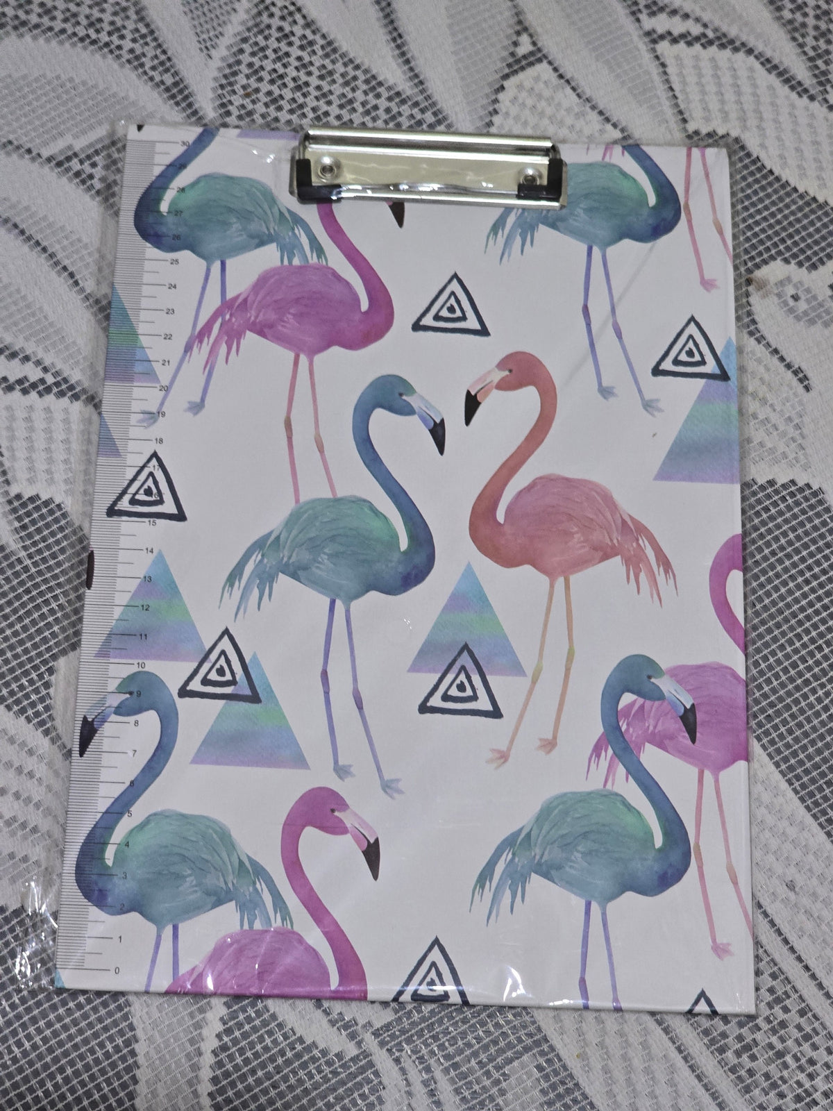 BioCode A4 clipboard featuring a vibrant flamingo and geometric triangle pattern with a sturdy metal clip and ruler