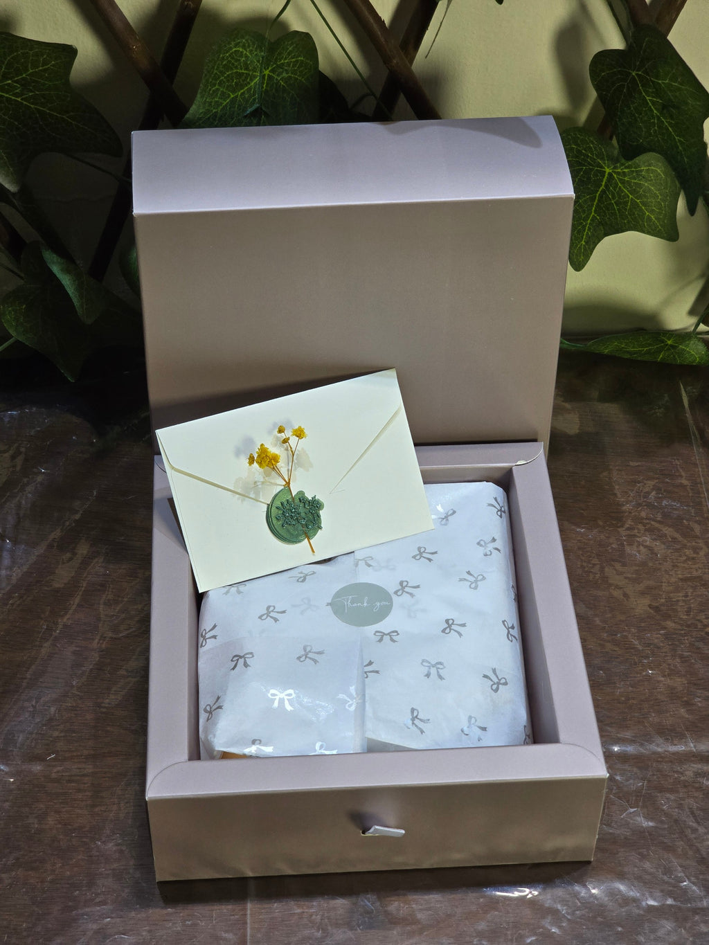 BioCode Fruit Crush beauty gift set in a sophisticated box with a wax-sealed note and ribbon-patterned tissue paper