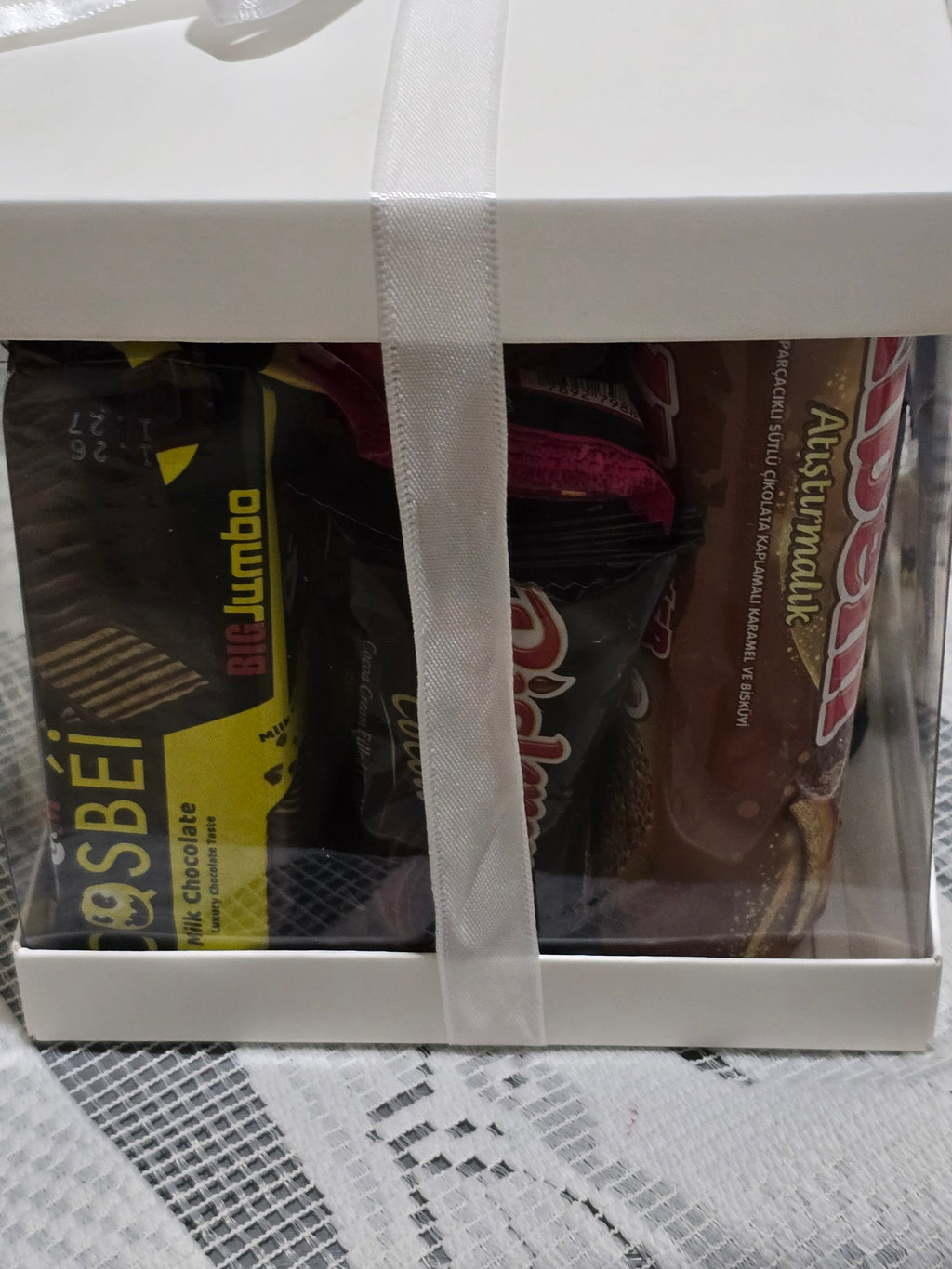 BioCode Happiness Box gift set featuring assorted premium chocolates and wafers in a white box with a white ribbon.