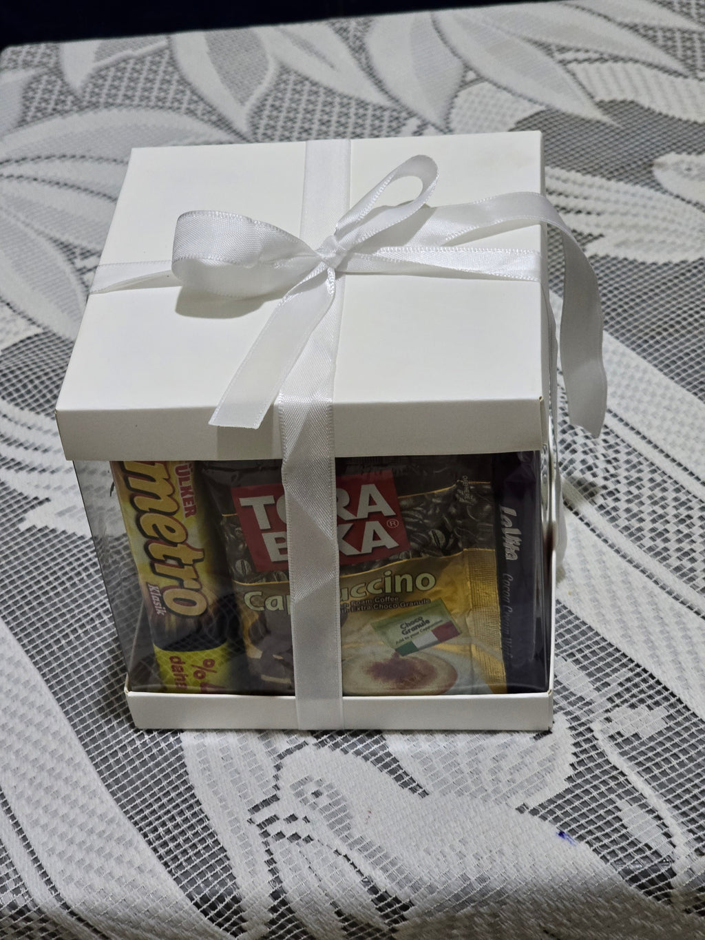 BioCode Happiness Box gift set featuring assorted chocolates and cappuccino sachets in a white box with a white ribbon