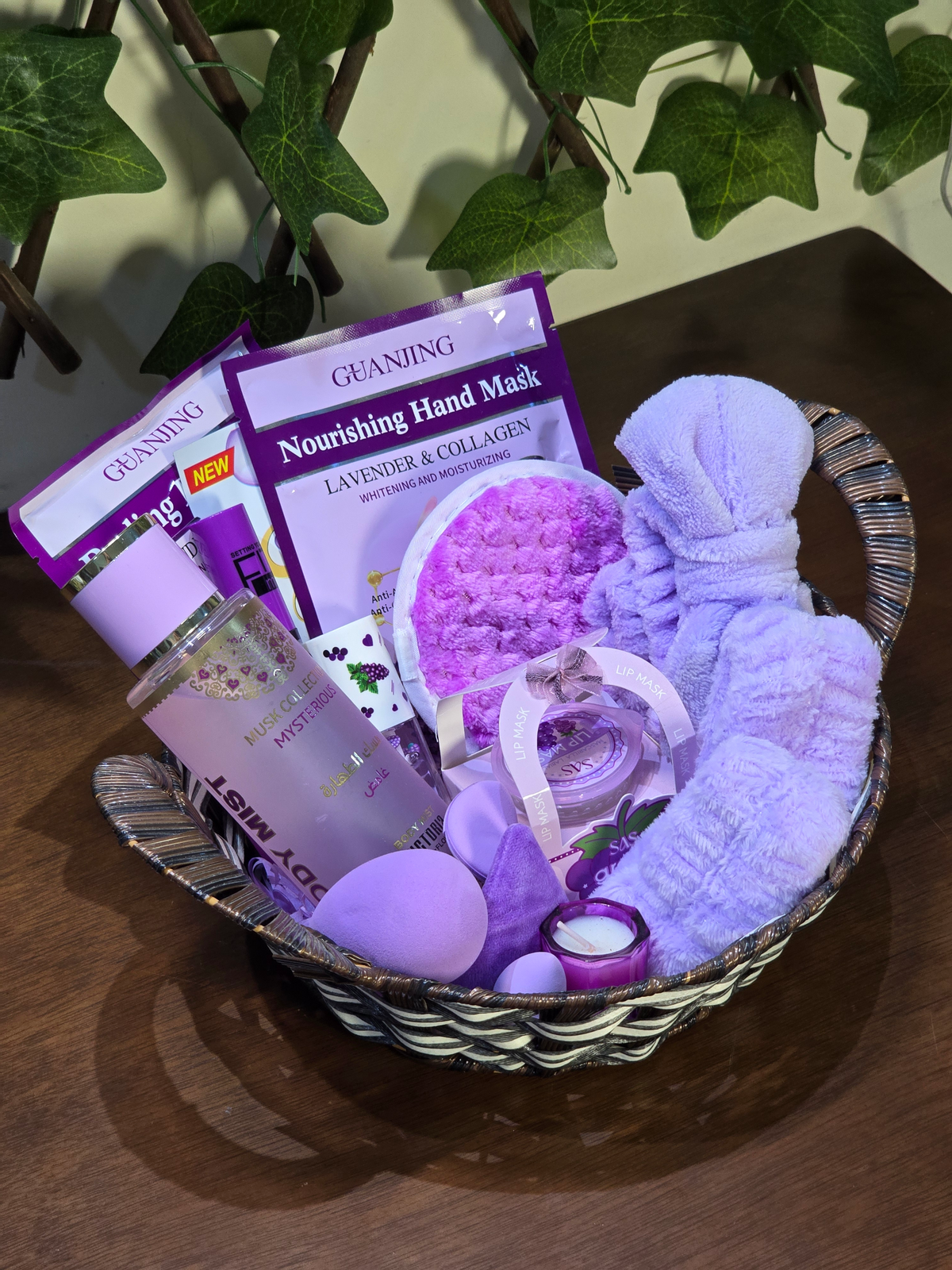 BioCode lavender-themed skincare gift basket featuring hand masks, body mist, plush headband, and scented candle.
