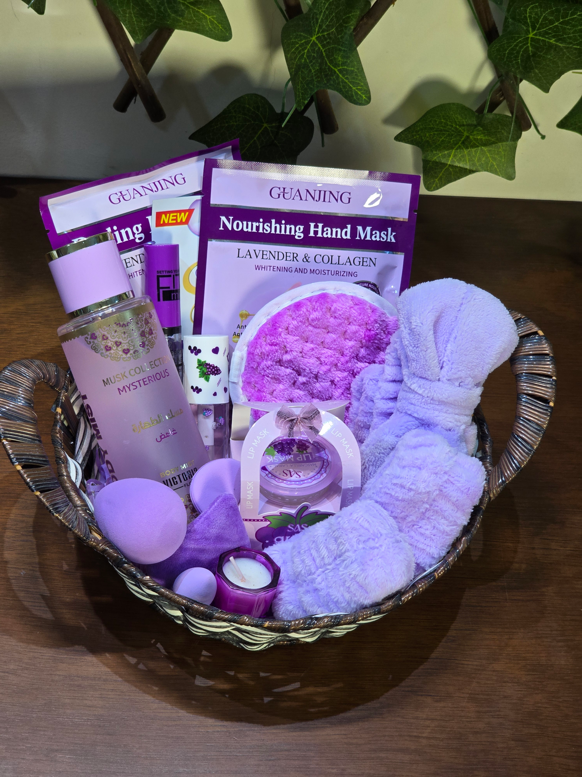 BioCode lavender-themed skincare gift basket with hand masks, body mist, plush headband, and scented candle.