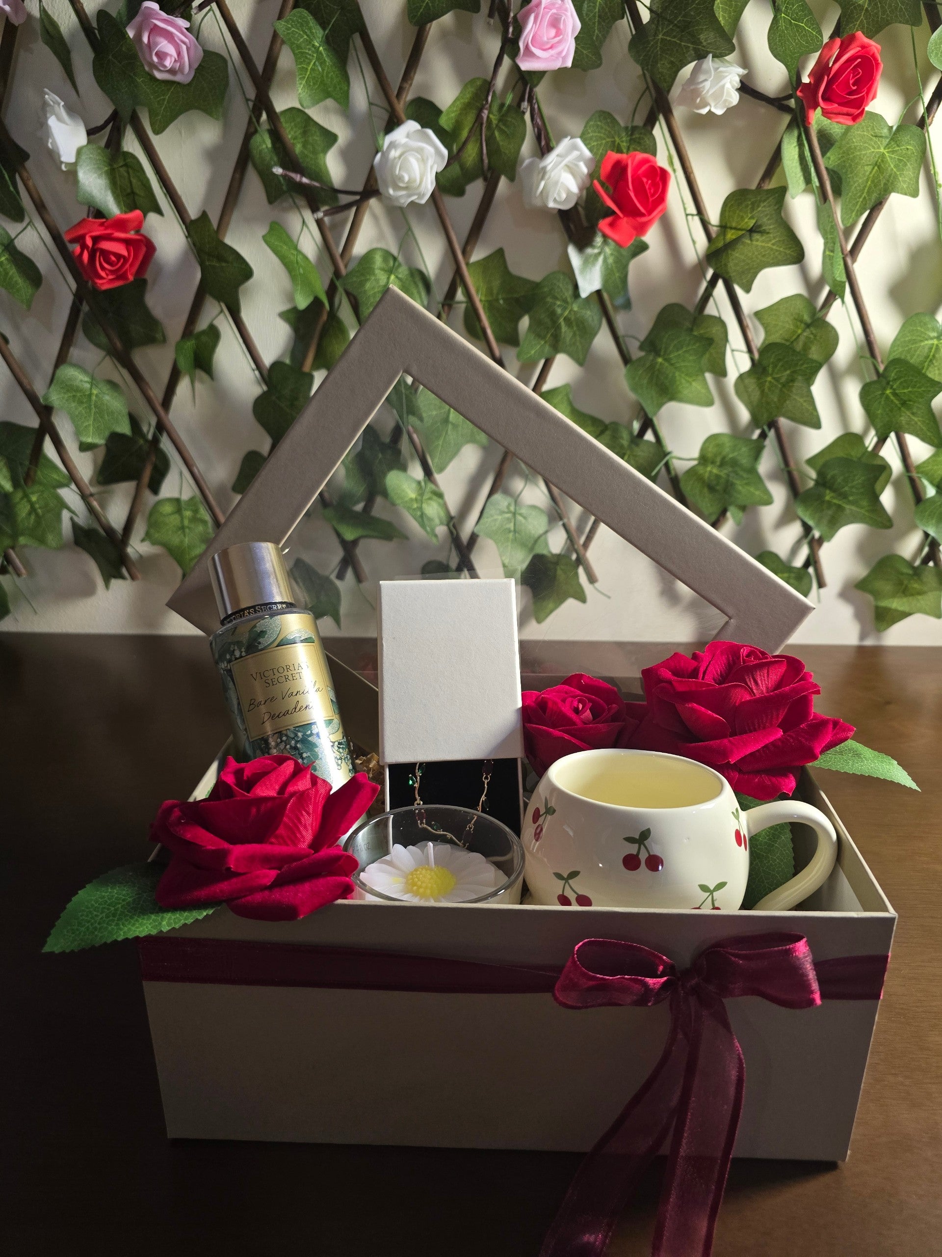 BioCode luxury gift box featuring Victoria's Secret fragrance, cherry mug, jewellery, and artificial red roses.