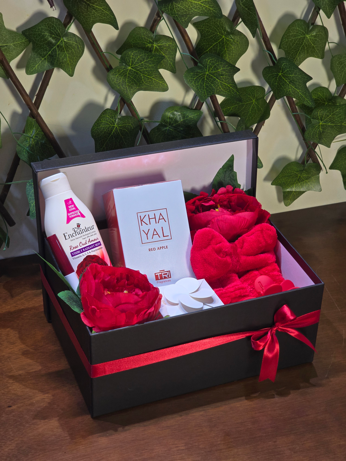 BioCode luxury pampering gift set in a black box with red ribbon, featuring Khayal perfume, lotion, and accessories.