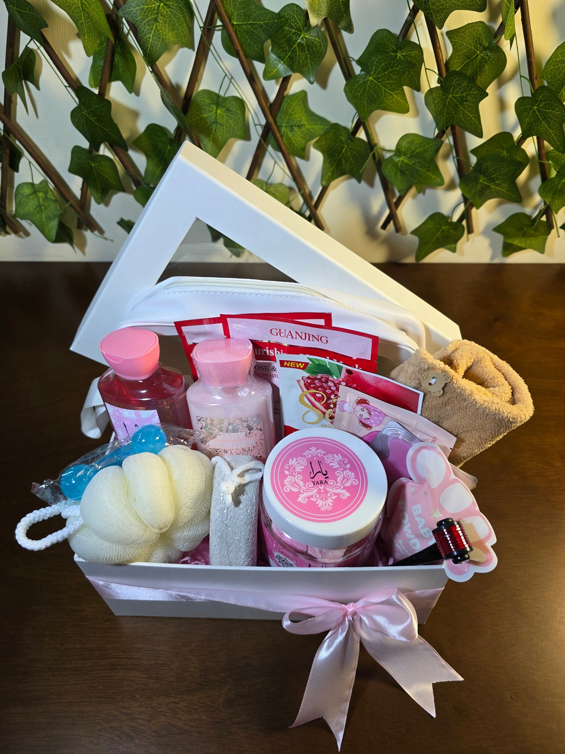 BioCode luxury pamper gift set in a white box with pink ribbon, featuring skincare, bath essentials, and accessories.