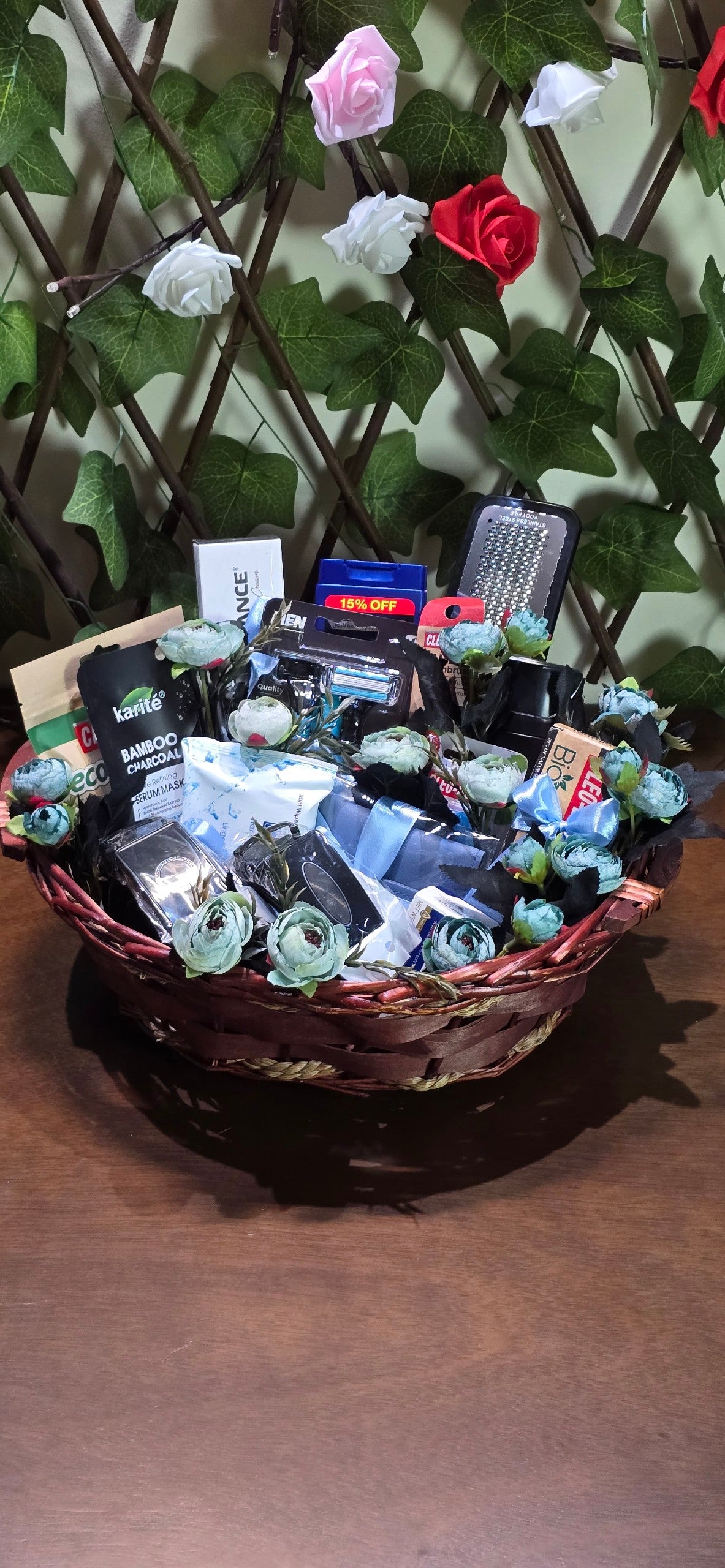 BioCode men's grooming gift hamper featuring charcoal skincare, shaving tools, and accessories in a decorative basket