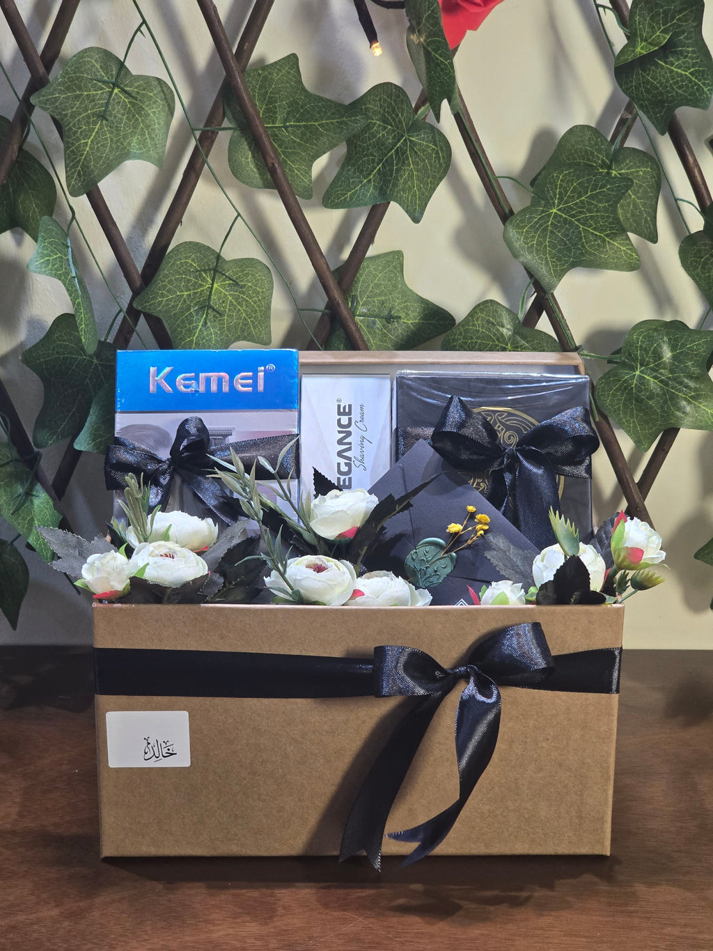 BioCode men's grooming gift set featuring Kemei trimmer, Elegance shaving cream, and fragrance in a decorated box.