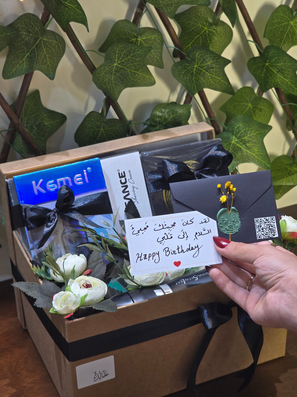 BioCode men's grooming gift set featuring Kemei trimmer, Elegance shaving cream, and Gissaty perfume in a decorated box