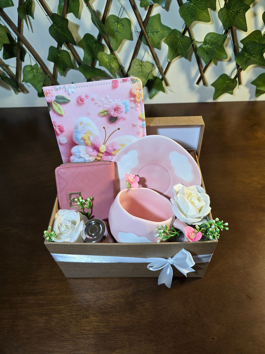 BioCode pink gift set featuring a butterfly notebook, textured wallet, and cloud-design ceramic mug in a ribboned box