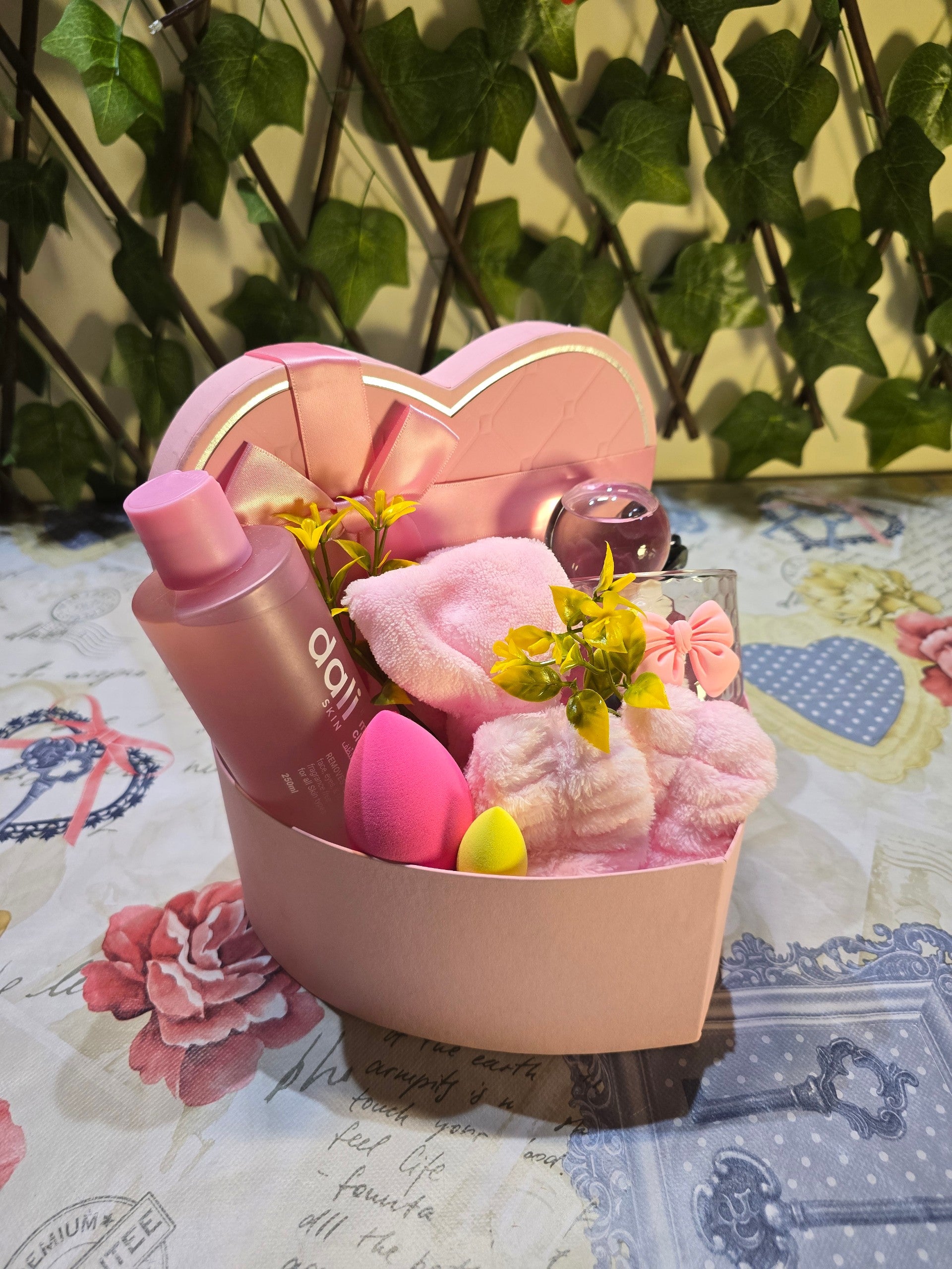 BioCode heart-shaped pink skincare gift set featuring facial cleanser, makeup sponges, and hair accessories.