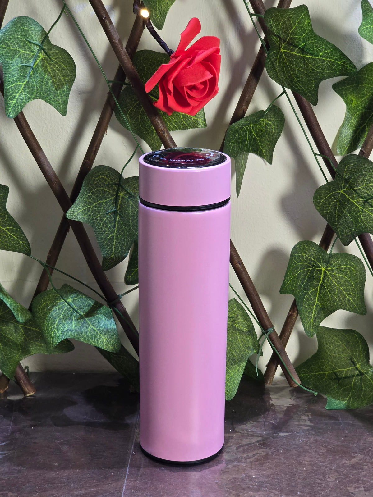 BioCode pastel pink stainless steel insulated water bottle with a digital LED temperature display lid.