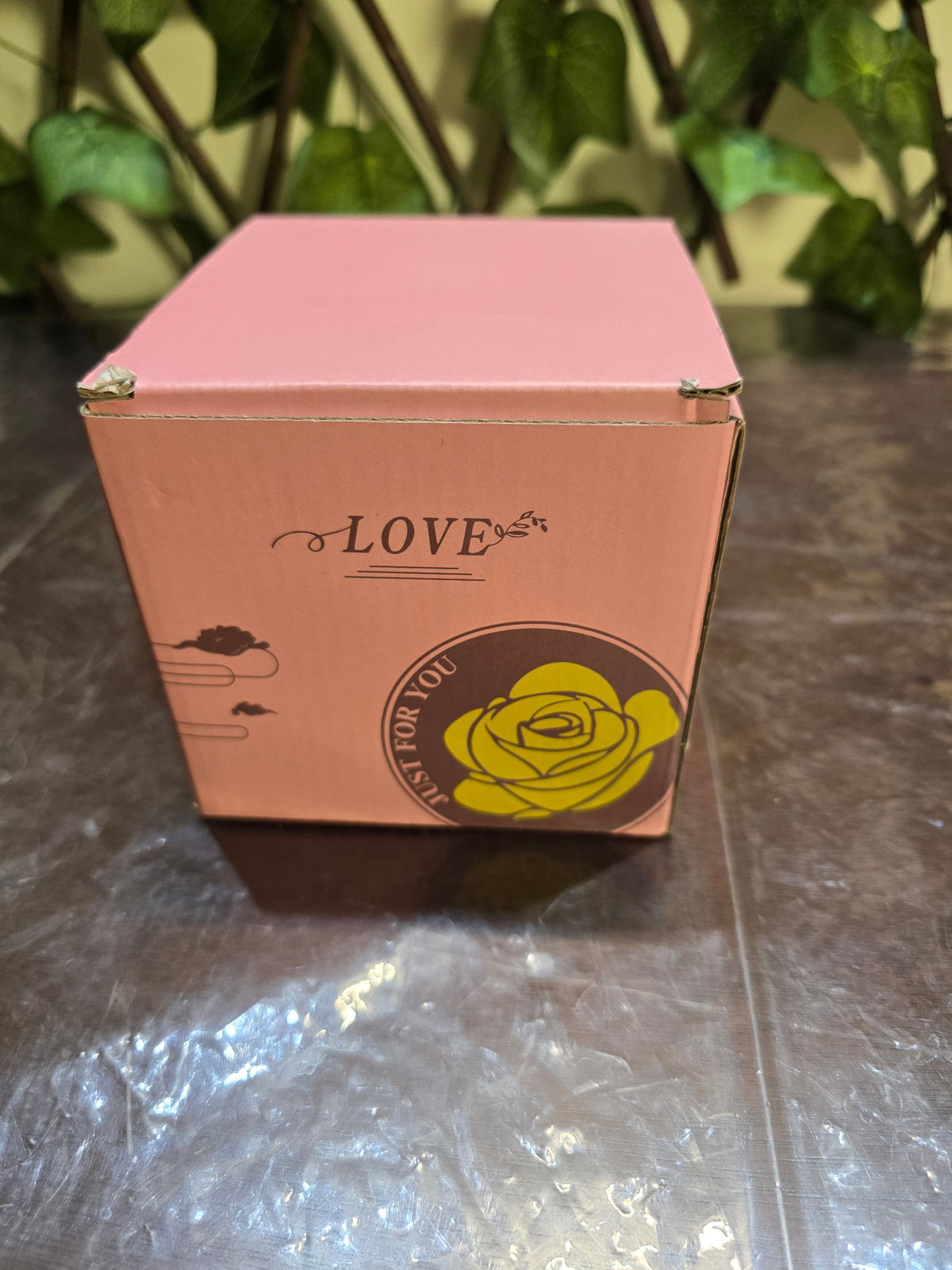 BioCode pink gift box for a preserved rose jewellery display featuring a yellow rose graphic and Love text