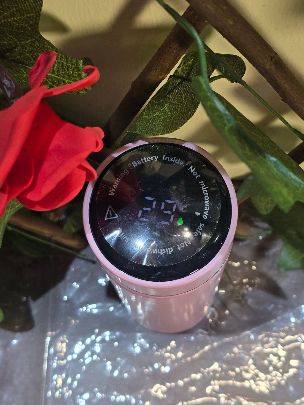 BioCode pastel pink stainless steel water bottle with an LED temperature display lid showing 29 degrees Celsius