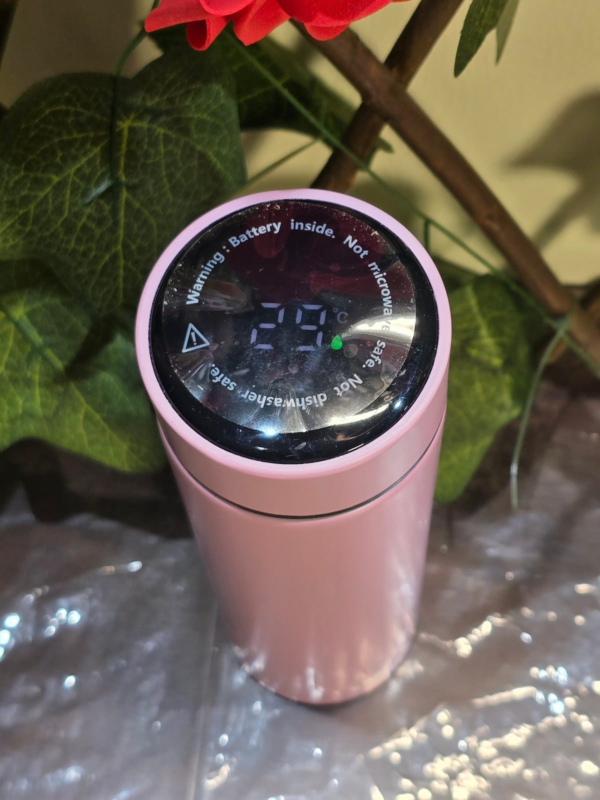 BioCode pastel pink stainless steel water bottle with an integrated LED temperature display on the lid