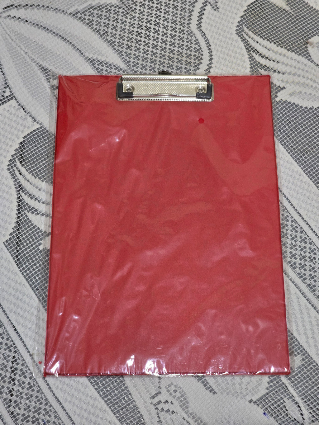 BioCode A4 red clipboard with a heavy-duty metal clip and integrated ruler, wrapped in protective plastic.