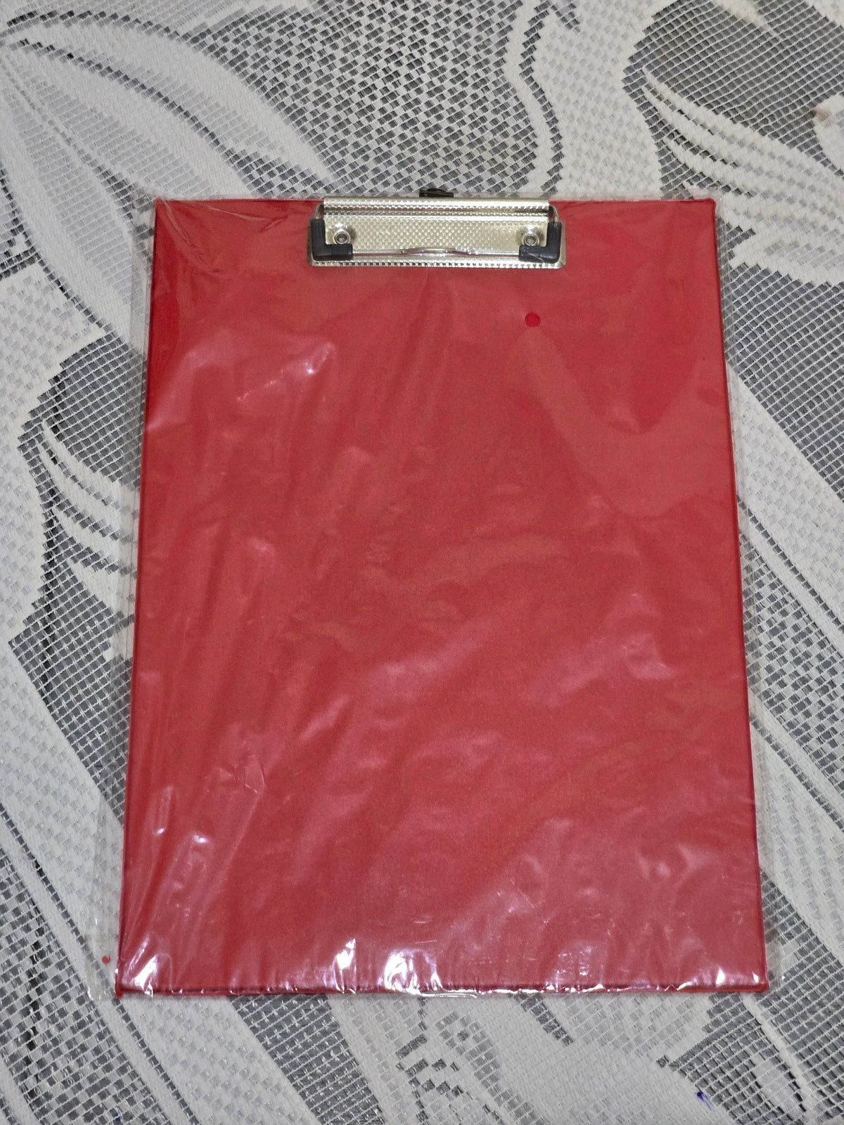 BioCode A4 red clipboard with a heavy-duty metal clip and integrated ruler, wrapped in protective plastic.