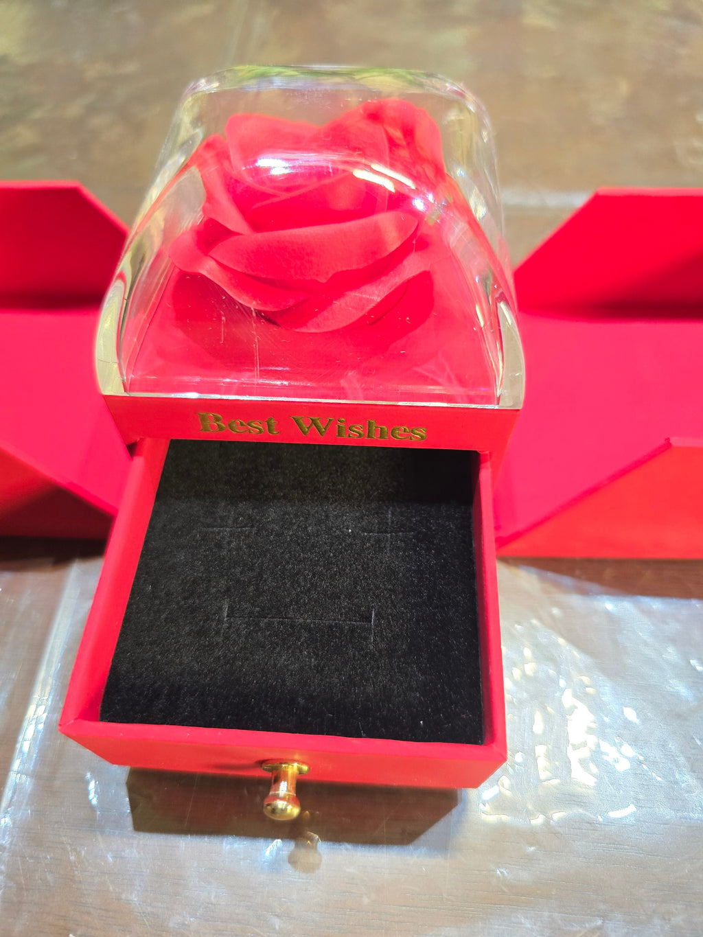 BioCode red jewellery gift box with a preserved rose under a clear cover and a black velvet-lined ring drawer