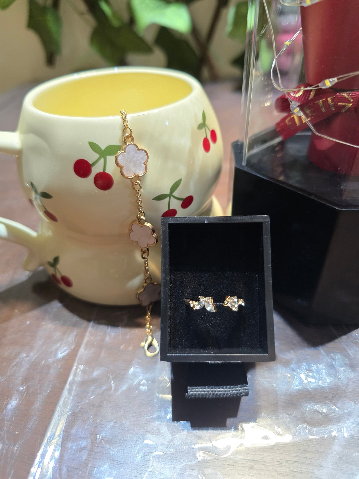 BioCode romantic gift set with cherry print mug, gold floral charm bracelet, crystal earrings, and preserved rose