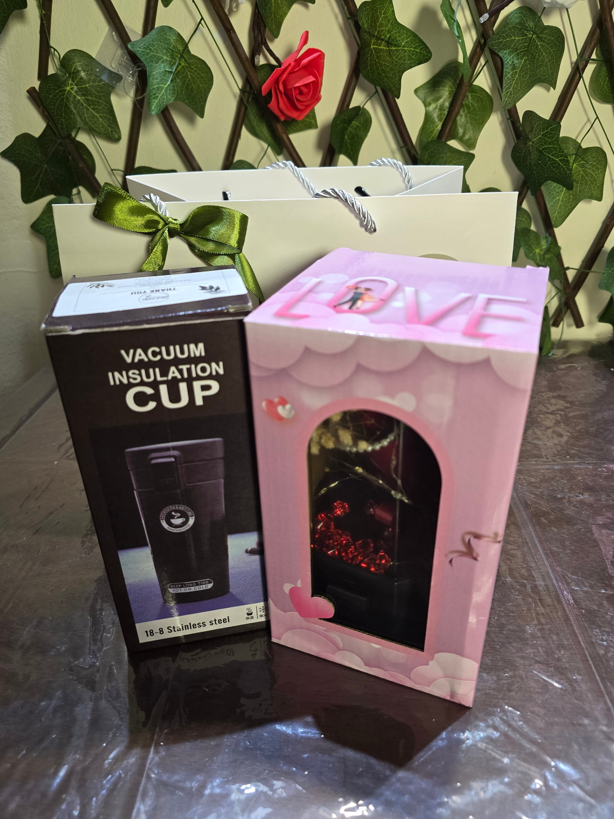 BioCode romantic gift set featuring a vacuum insulated cup box and a preserved rose display case in a gift bag.