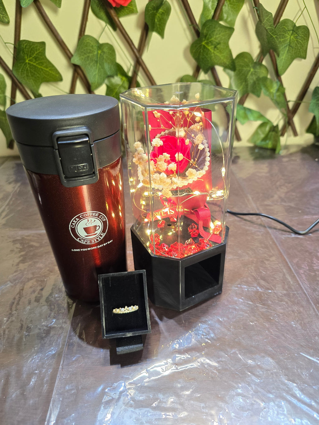BioCode romantic gift set featuring a metallic red vacuum cup, a preserved rose in a light-up case, and a pearl ring.