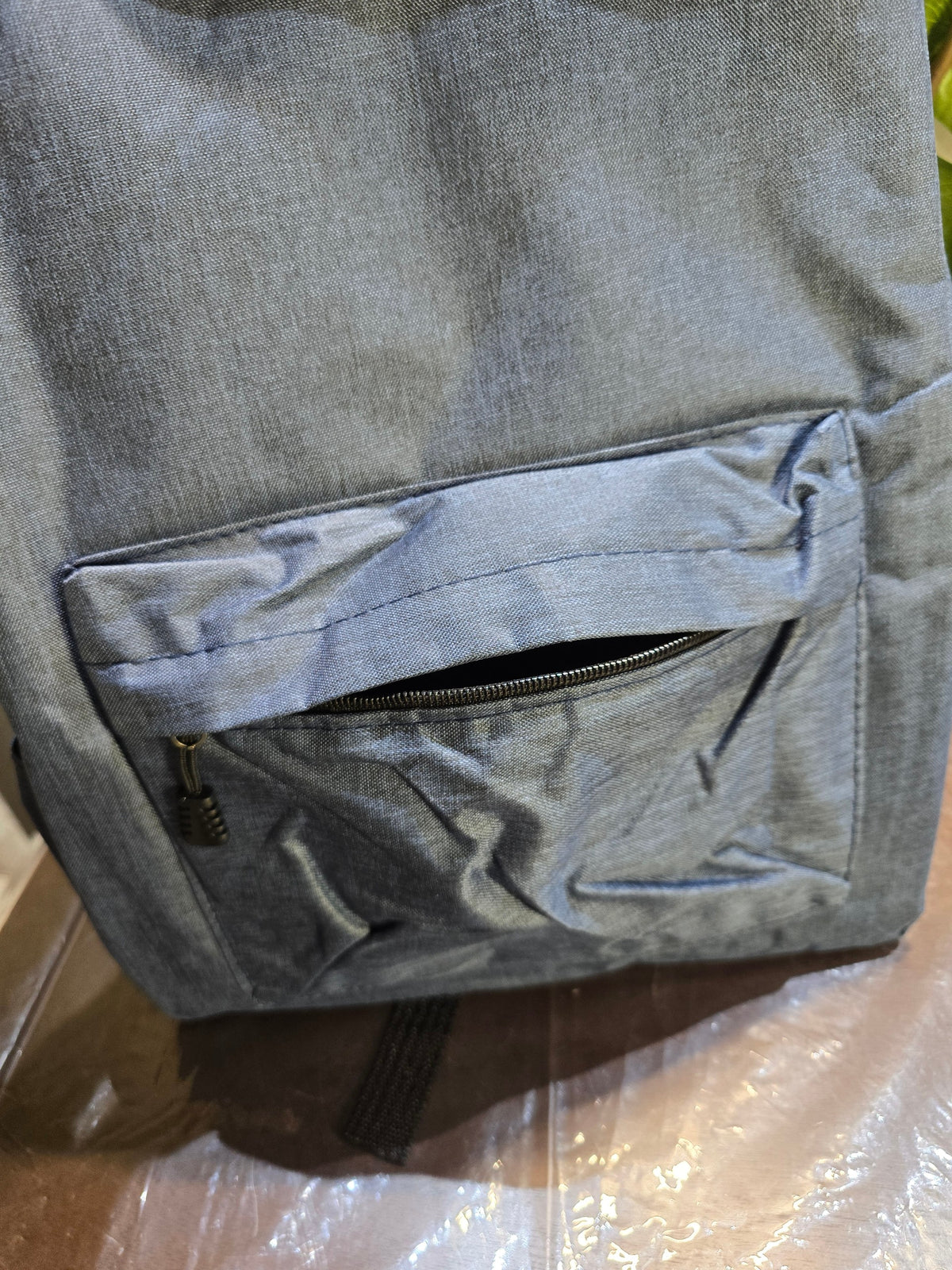 BioCode slate-blue minimalist backpack with a durable textured fabric and a secure front zip pocket