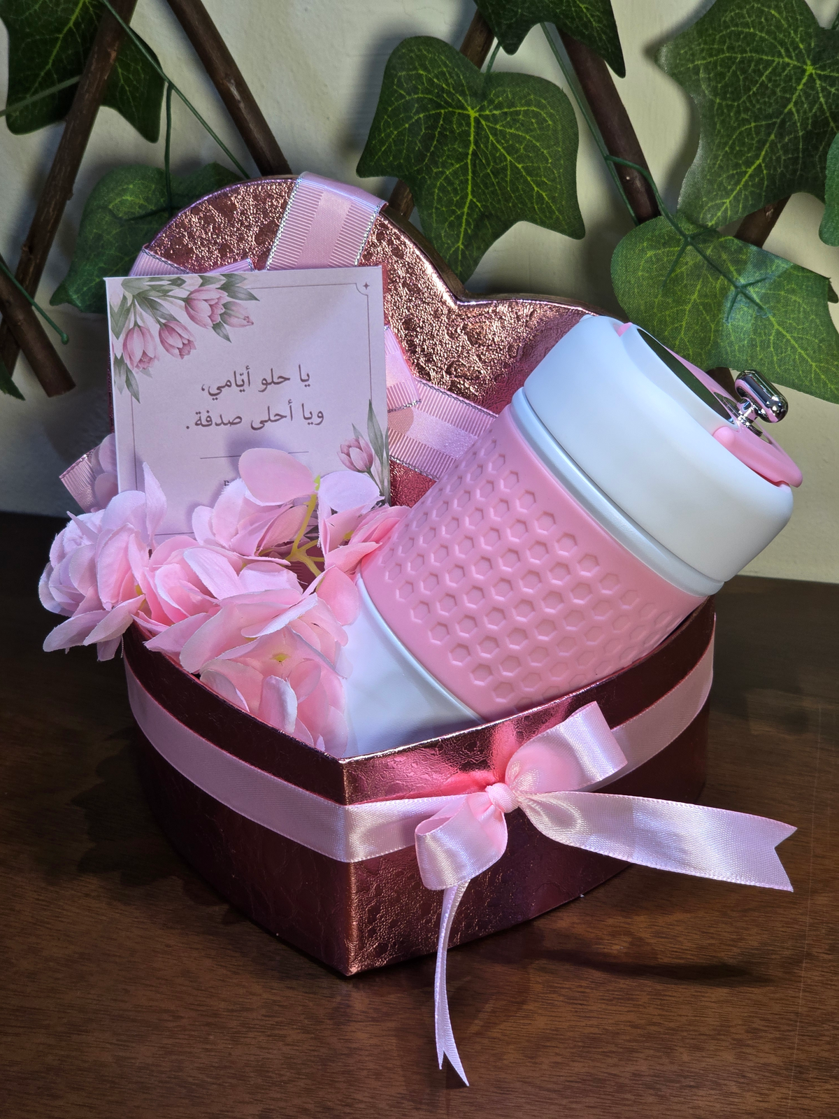 BioCode insulated travel mug with digital temperature display in a heart-shaped gift box with pink flowers and card.