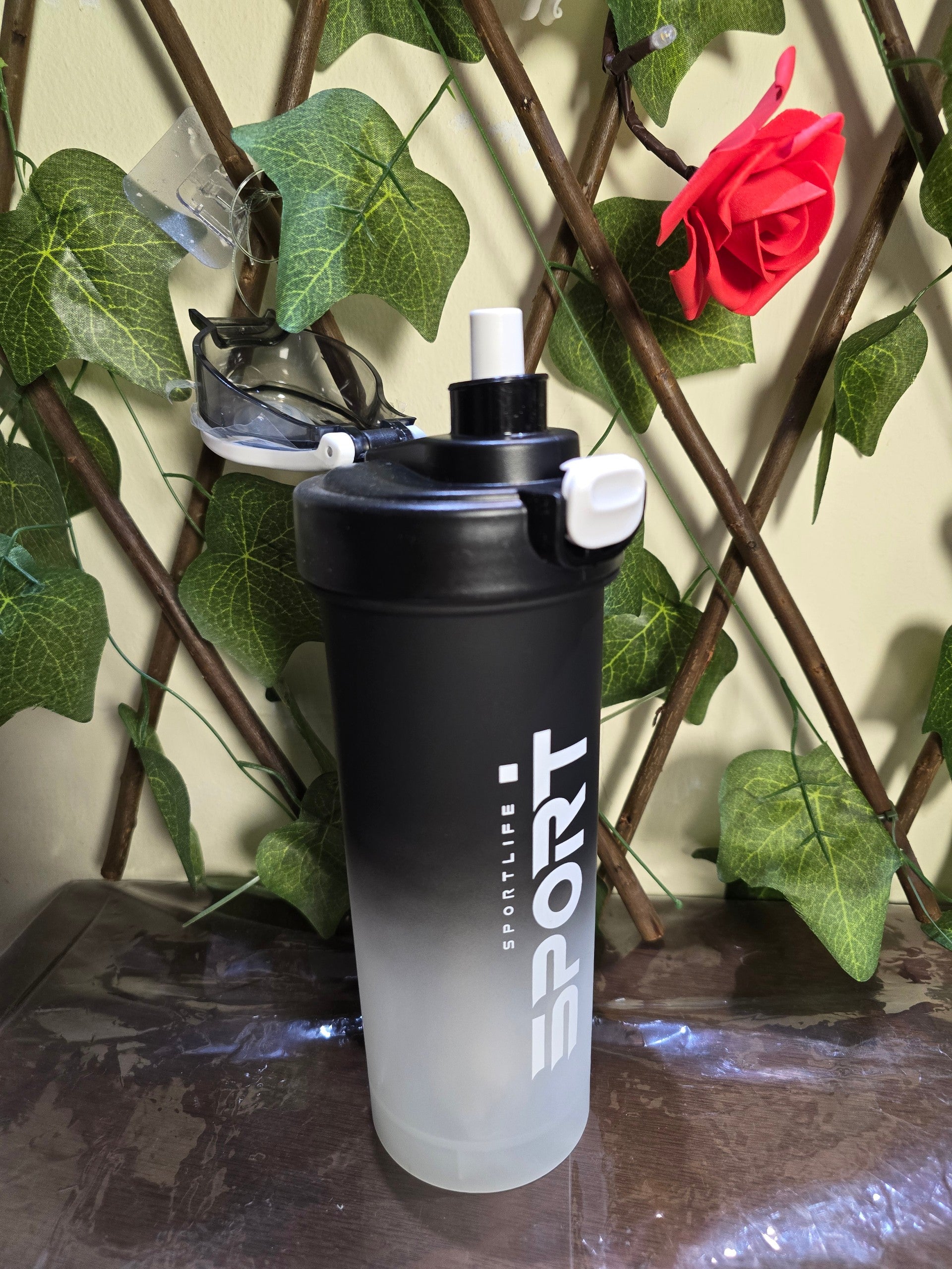 BioCode Sportlife shaker bottle with black-to-clear gradient finish, leak-proof lid, and white spout