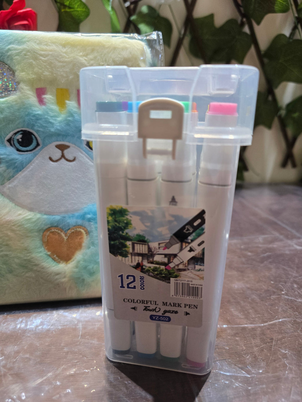 BioCode stationery set featuring a plush cat notebook and a clear carry case with 12 colourful markers