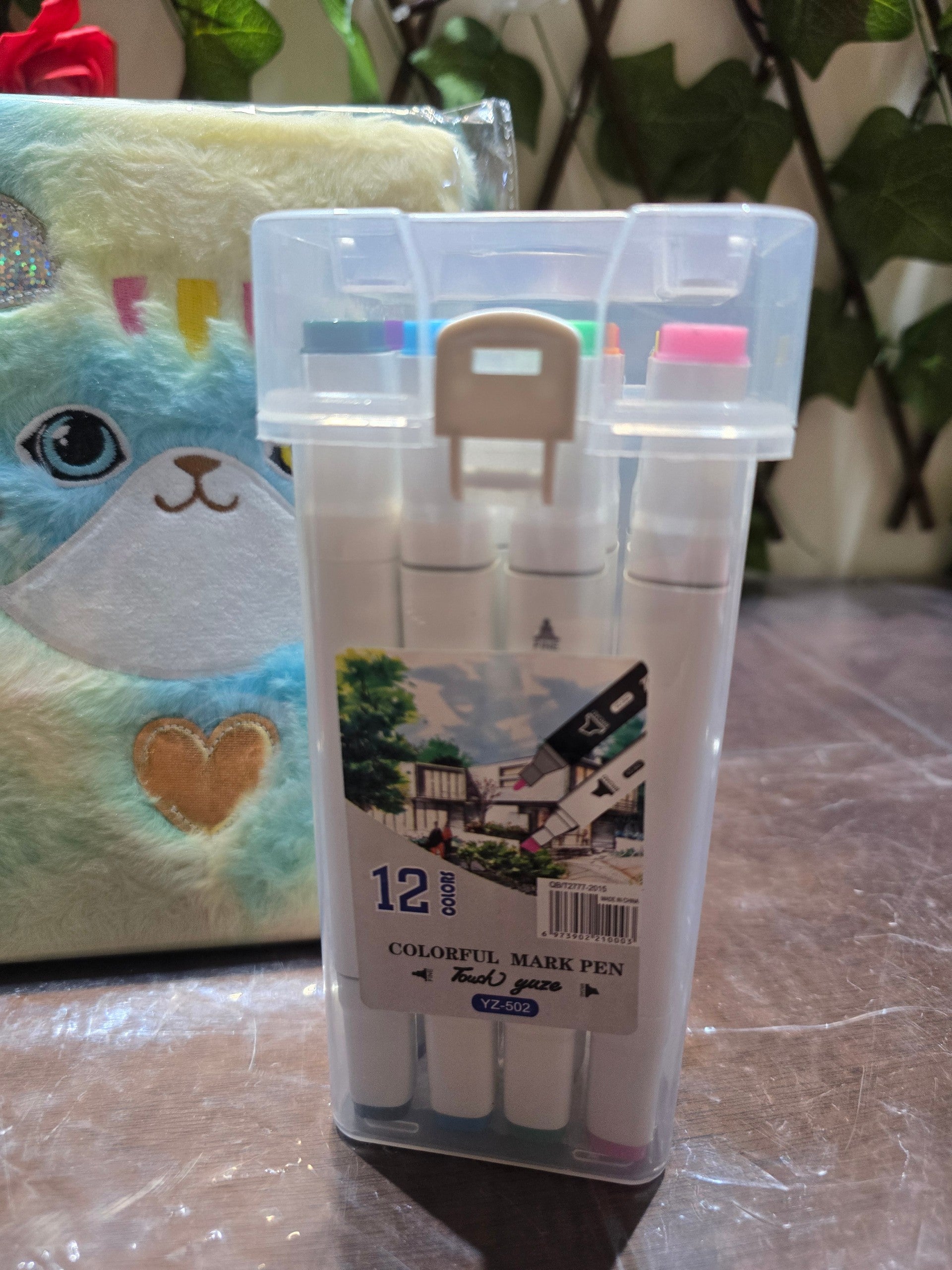 BioCode stationery set featuring a plush cat notebook and a clear carry case with 12 colourful markers