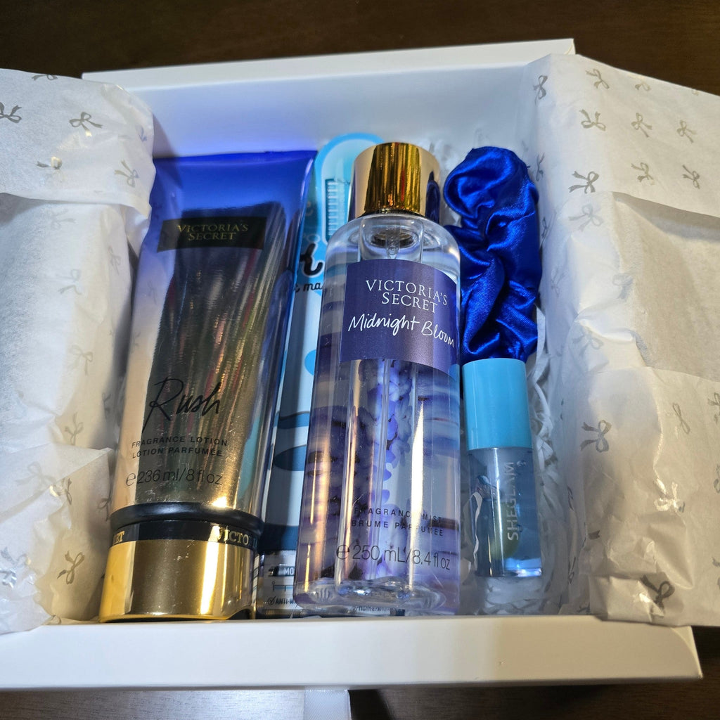 BioCode Victoria's Secret fragrance gift set featuring Rush lotion, Midnight Bloom mist, blue scrunchie, and lip gloss.