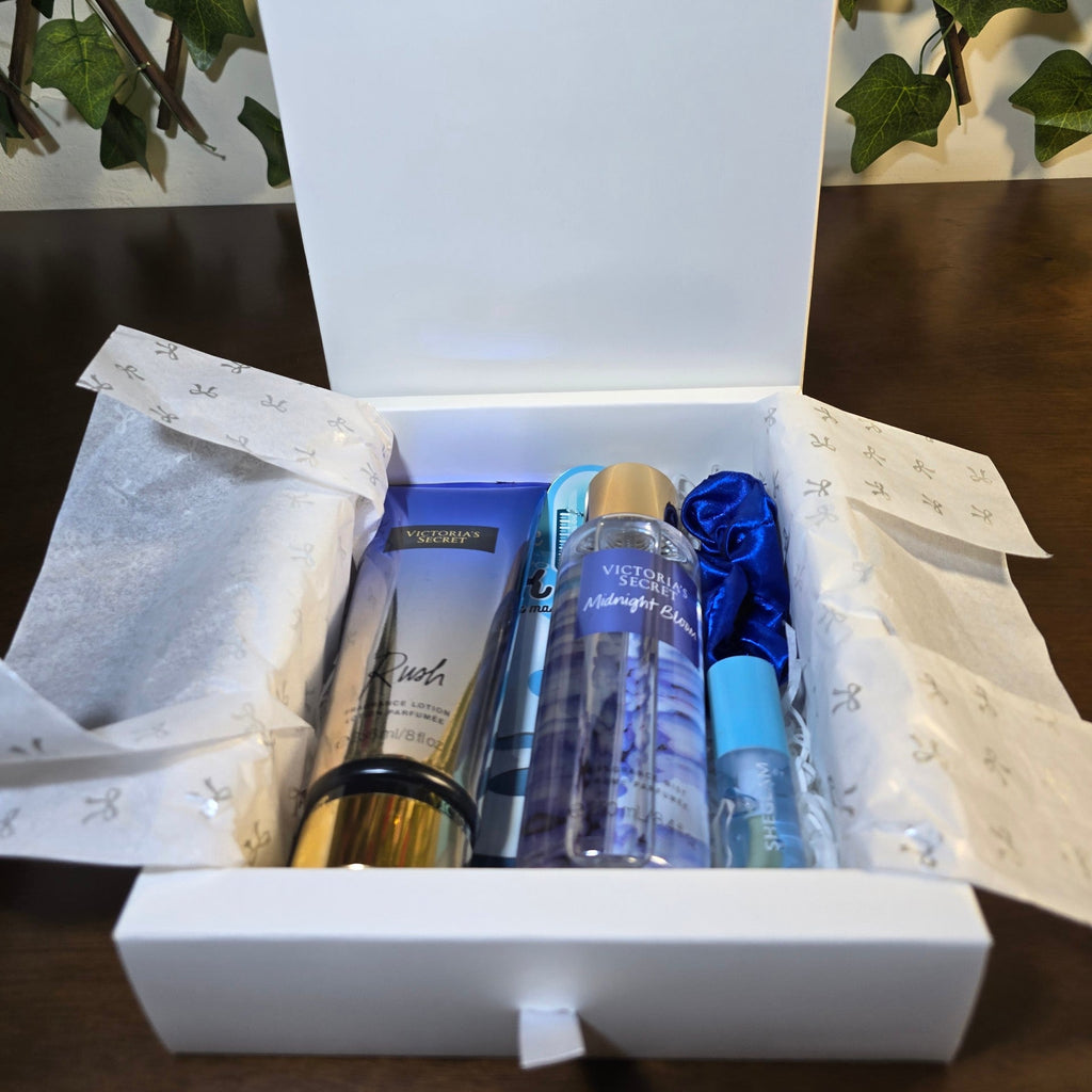 BioCode Victoria's Secret gift set in a white box with Rush lotion, Midnight Bloom mist, and a blue satin scrunchie.