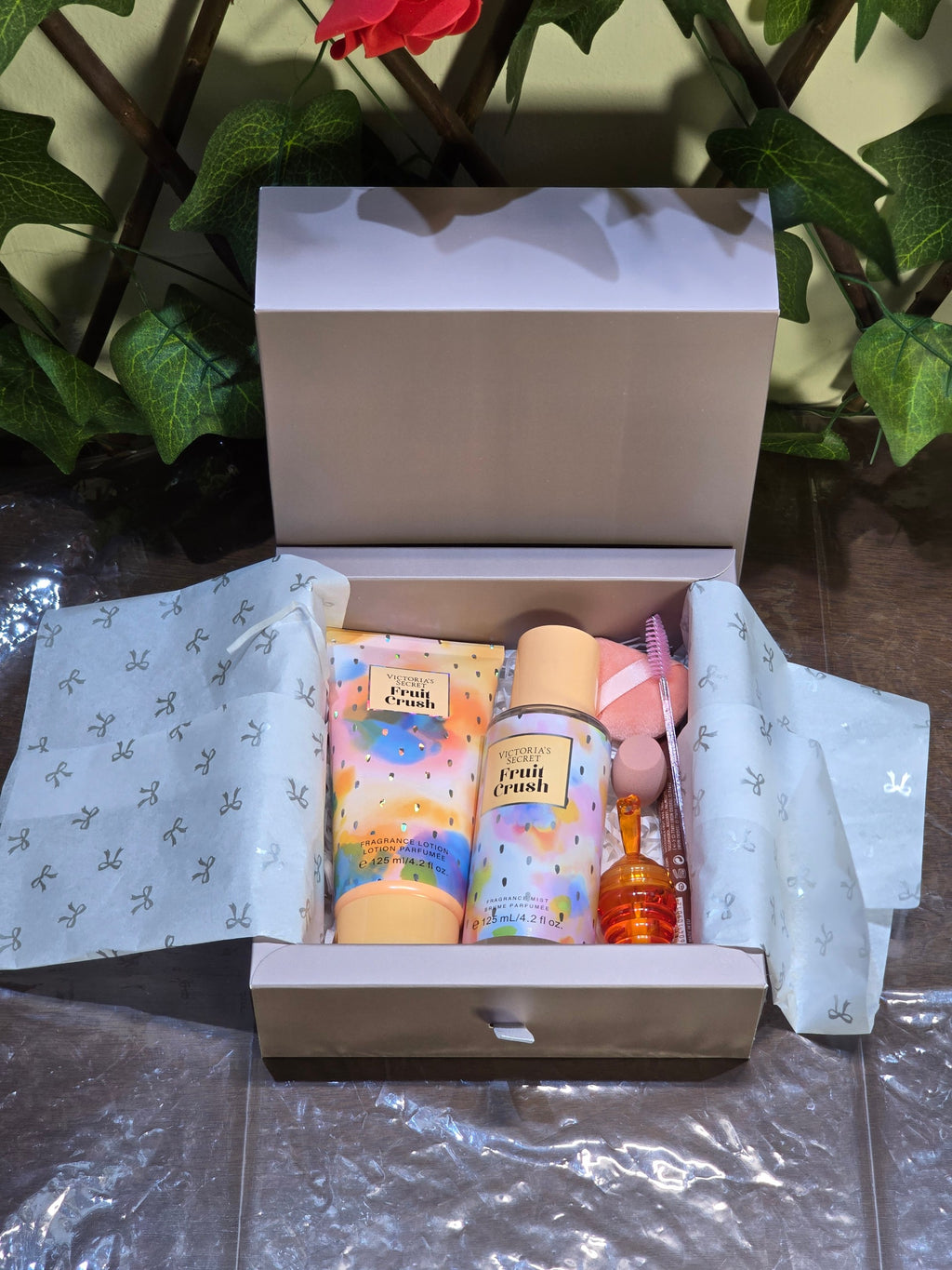 BioCode Victoria's Secret Fruit Crush gift set featuring fragrance mist, lotion, makeup sponges, and lip balm in a box.