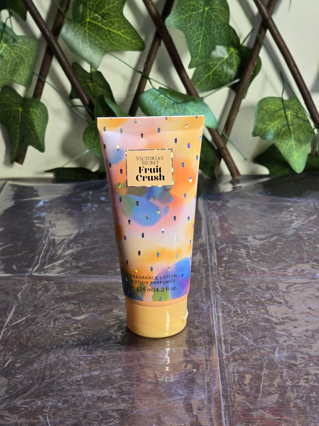 BioCode Victoria's Secret Fruit Crush fragrance lotion in a colourful tube with holographic accents