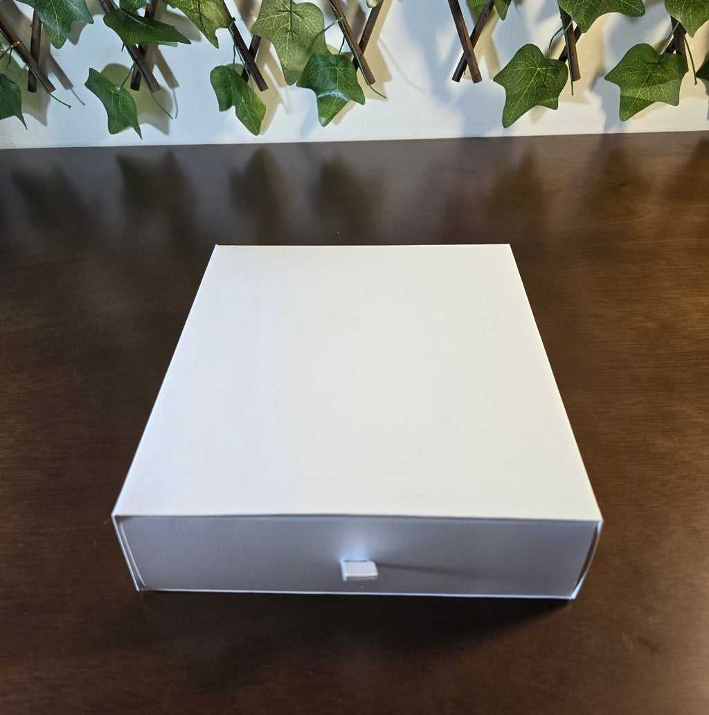 BioCode Victoria's Secret fragrance gift set in a sleek white presentation box on a dark wooden surface